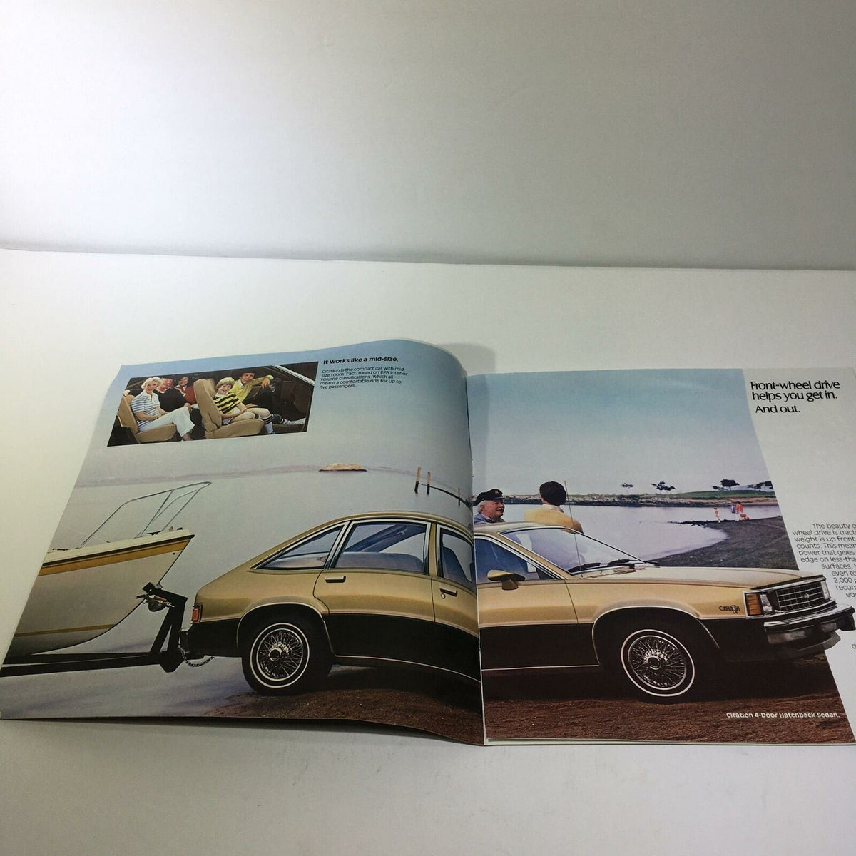 1981 Chevrolet Citation 4-Door Hatchback Sedan Car Sale Brochure interior image showing the car's spacious interior and features, highlighting lifestyle use with a boat in the background.