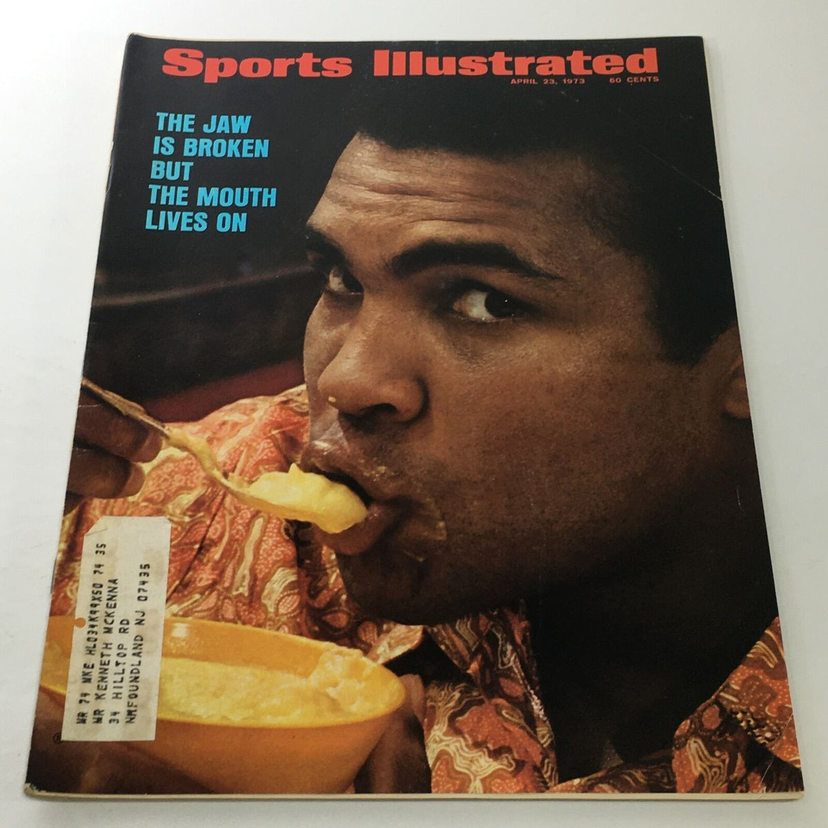 Sports Illustrated April 23 1973 cover featuring Muhammad Ali with the headline 'The Jaw Is Broken but The Mouth Lives On', showcasing the boxing legend during a moment of reflection.