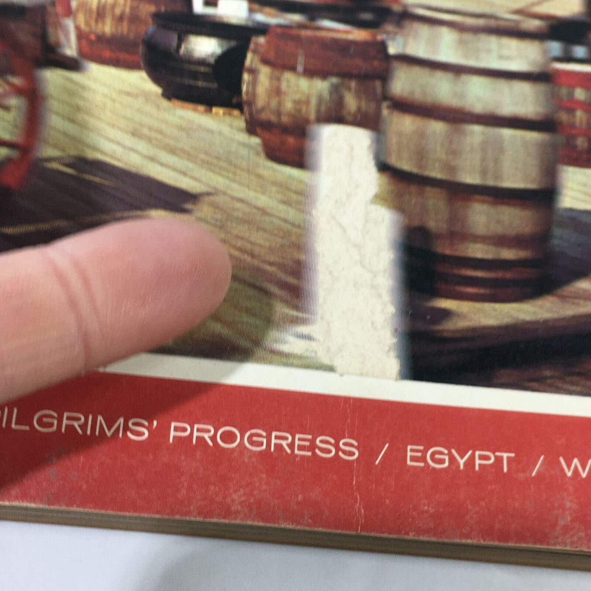Close-up of the cover of VTG Venture Magazine Book from October 1965, showing details around the title and features including barrels and a finger pointing at the imperfections.
