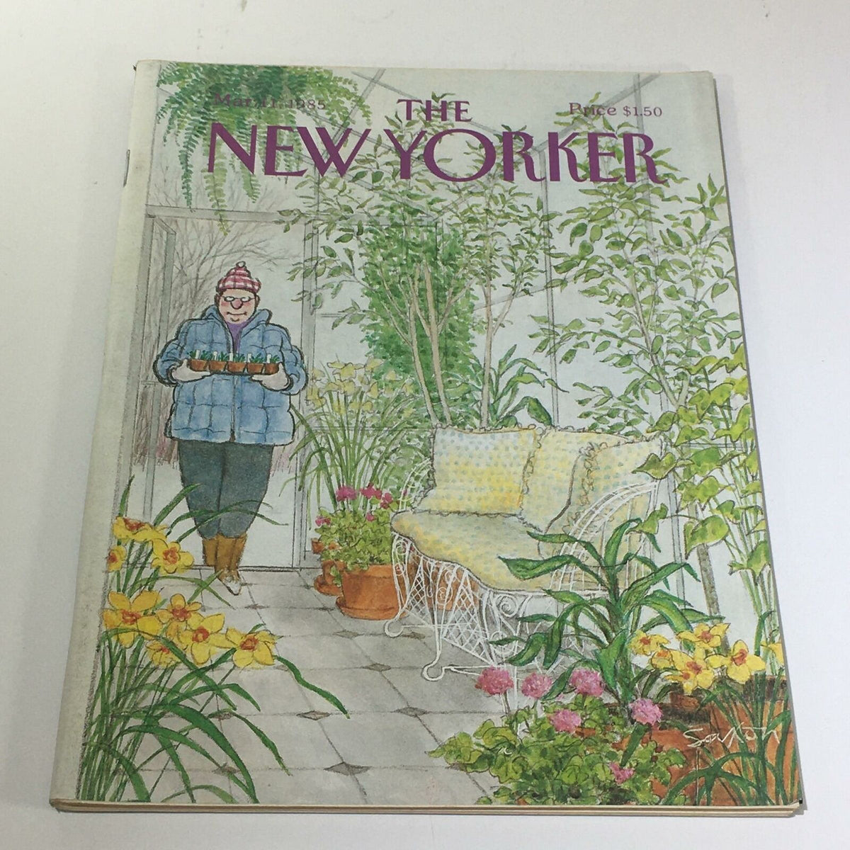 The New Yorker Magazine March 11 1985 Full Theme Cover illustrated by Charles Saxon, featuring a cozy indoor garden scene with a figure wearing a winter jacket, surrounded by vibrant flowers and plants.
