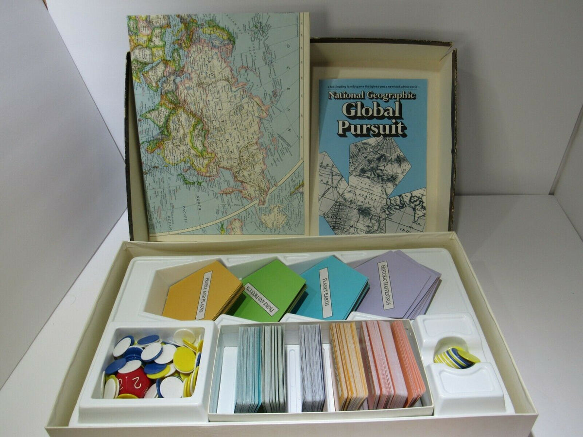 Vintage 1987 National Geographic Global Pursuit Complete Game Board shown in its original box featuring colorful game pieces, maps, and trivia cards for an educational and engaging geography-themed experience.