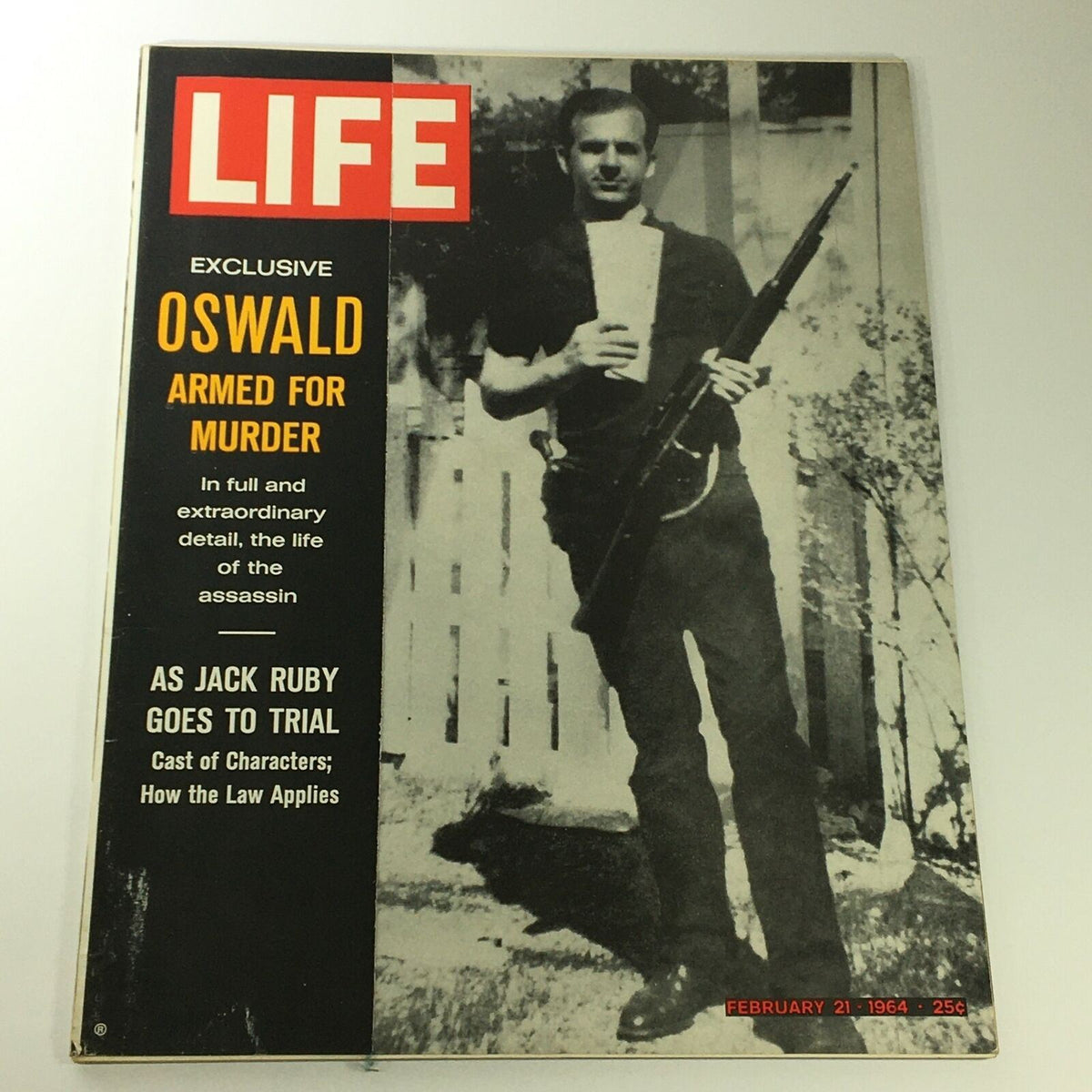 VTG Life Magazine February 21 1964 featuring Lee Harvey Oswald on the cover, showcasing him with a rifle. The issue includes exclusive content about Oswald's life and context around the Jack Ruby trial.