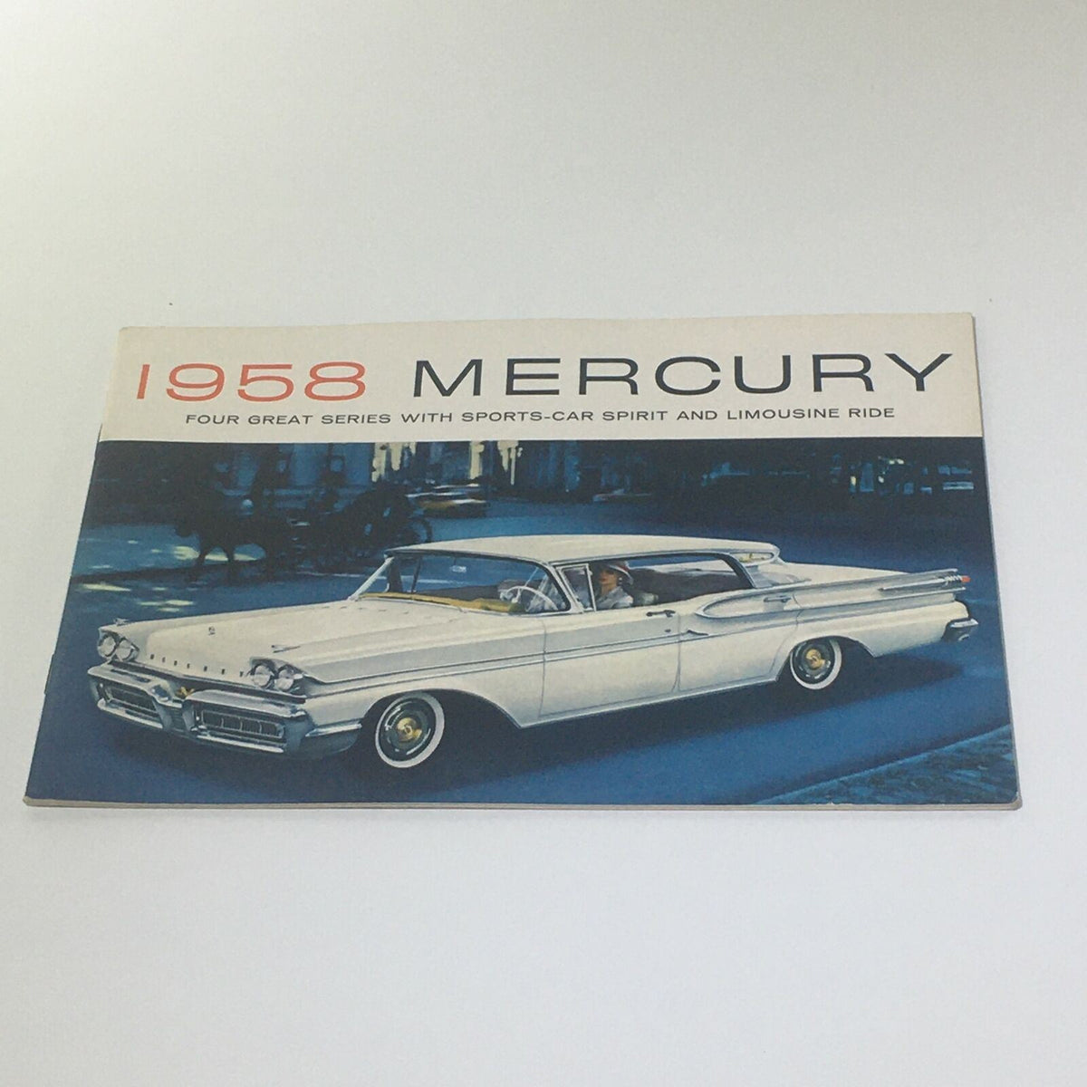 1958 Mercury 24-page vintage sales brochure illustrating the Mercury Park Lane, highlighting its elegant design and classic appeal in a nostalgic setting.