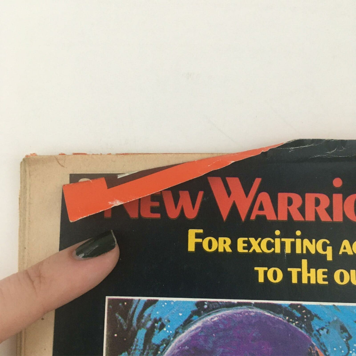Close-up of the top edge of the back cover of Creepy Magazine August 1981 #130, highlighting a tear and a colorful advertisement.