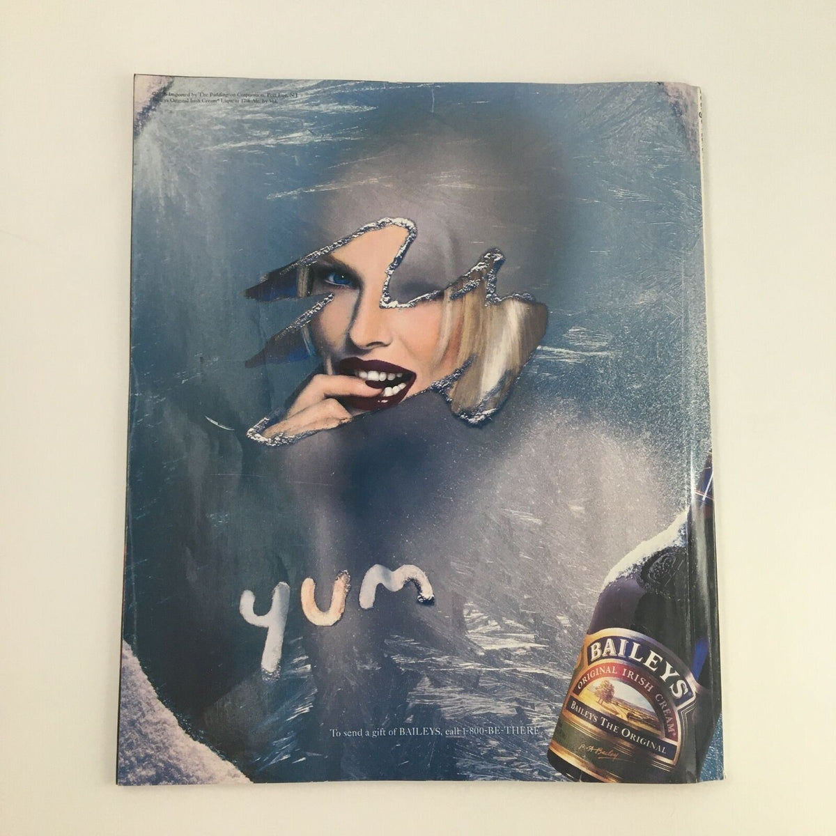 Creative advertisement in George Magazine February 1997 for Bailey's Irish Cream featuring a stylish model and artistic design.