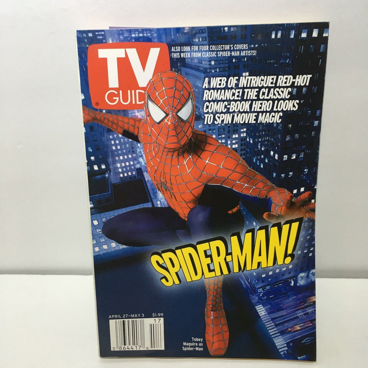 TV Guide April 27-May 3 2002 featuring Spider-Man on the cover, showcasing Tobey Maguire as Spider-Man, vibrant colors, and a dynamic pose against a city skyline.