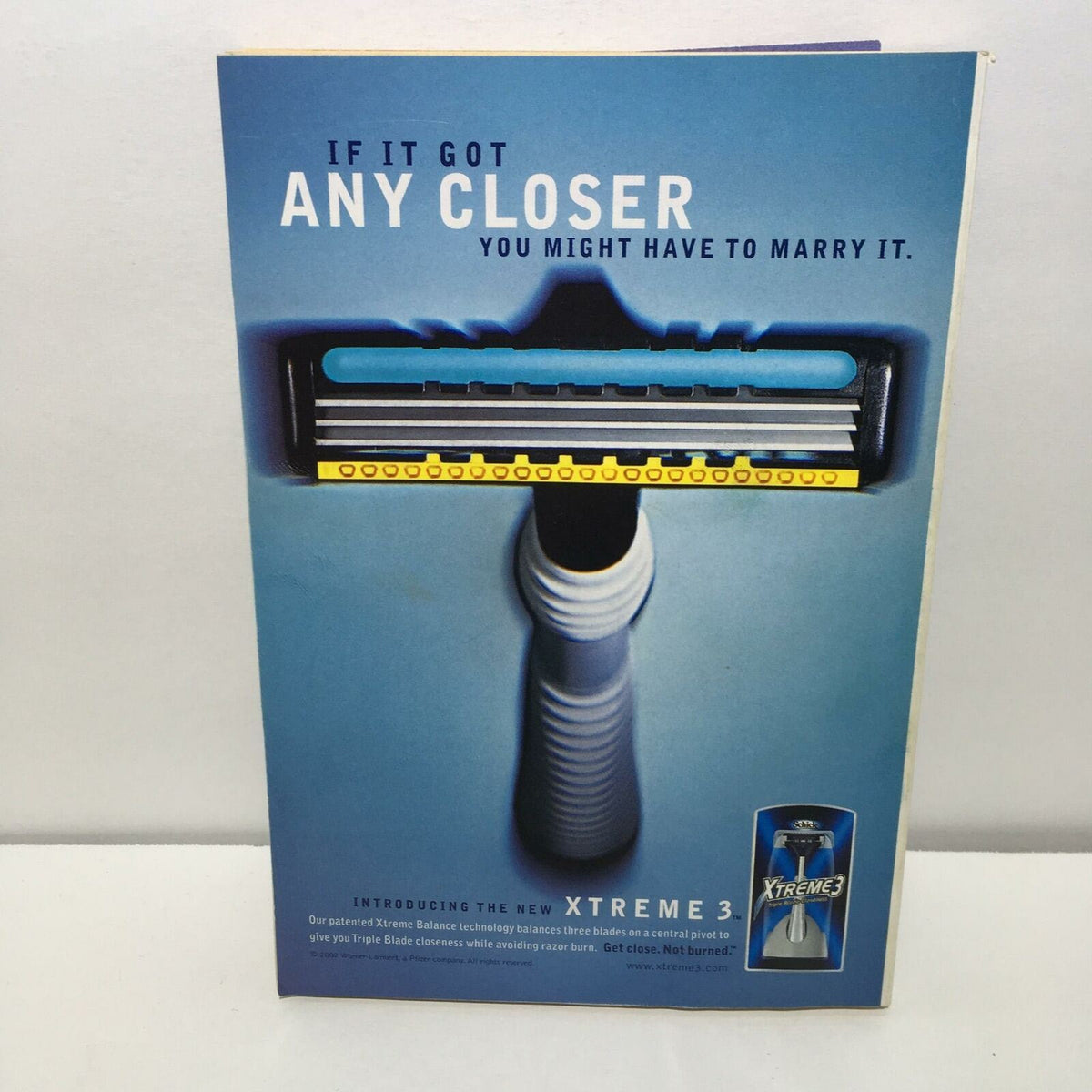Promotional page for the Xtreme 3 razor, featuring the tagline 'If it got any closer you might have to marry it', included in the TV Guide April 27-May 3 2002 Spider-Man! Tobey Maguire Cover.