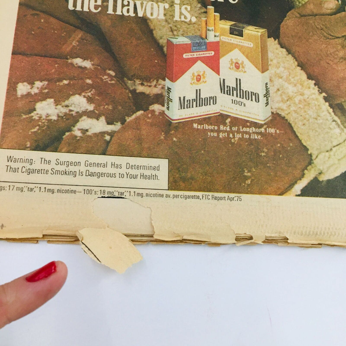 Detail of the Marlboro advertisement on the back of the Rolling Stone Magazine December 4, 1975, showing the iconic branding and health warning typical of the era for issue #201.