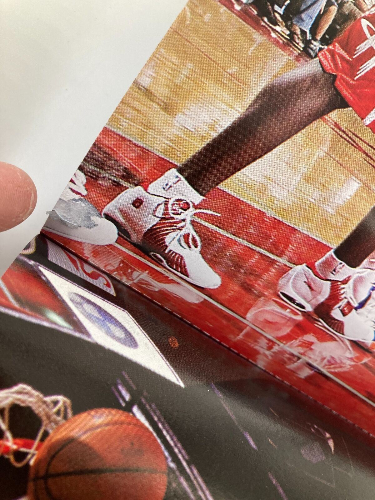 Close-up detail of LeBron James' signature sneakers and court during a game, highlighting the sports memorabilia from Slam Magazine December 2005.