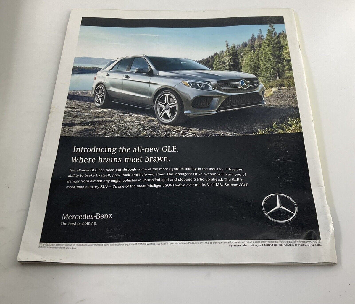 Back cover of The New York Times Magazine from October 11, 2015, displaying a Mercedes-Benz advertisement with a sleek SUV against a scenic background.