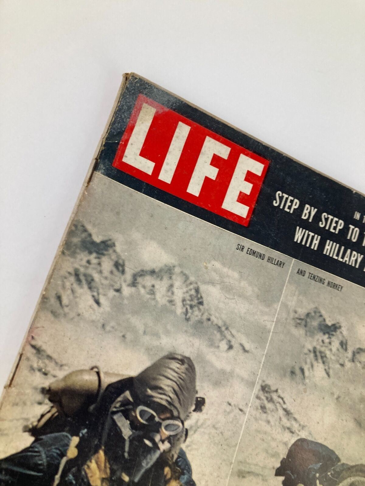 Close-up of the Life Magazine cover from July 13, 1953, highlighting the titles related to Sir Edmund Hillary and Tenzing Norgay's ascent of Everest.
