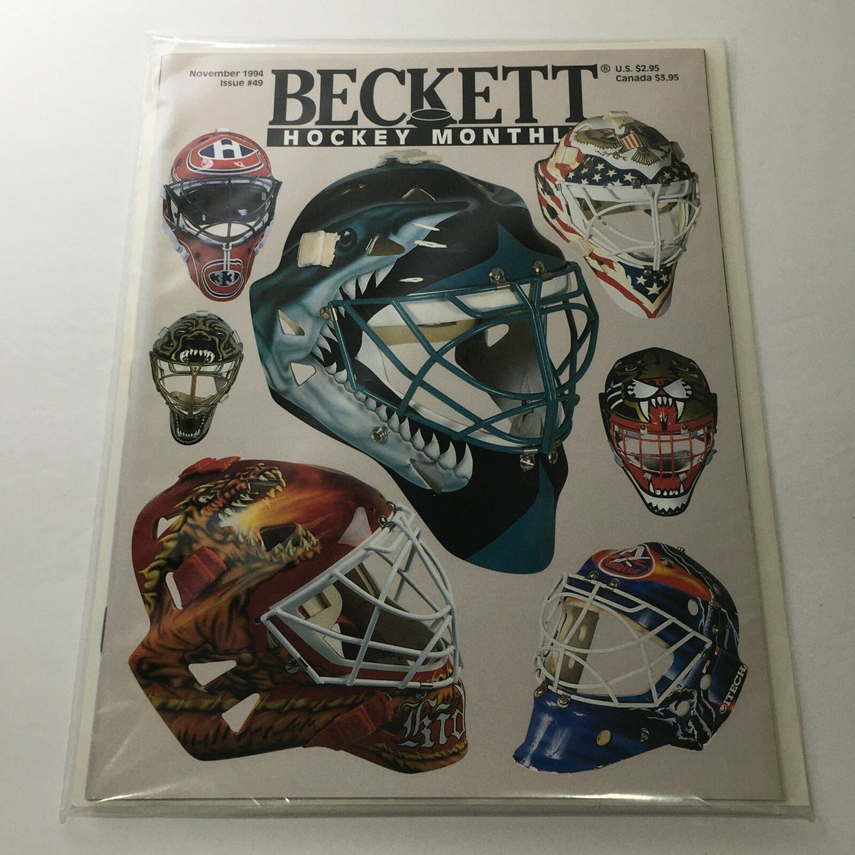 Beckett Hockey Monthly November 1994 Issue #49 featuring goalie masks, showcasing a collection of unique designs including a shark, dinosaur, and other vibrant styles, perfect for collectors and hockey fans.