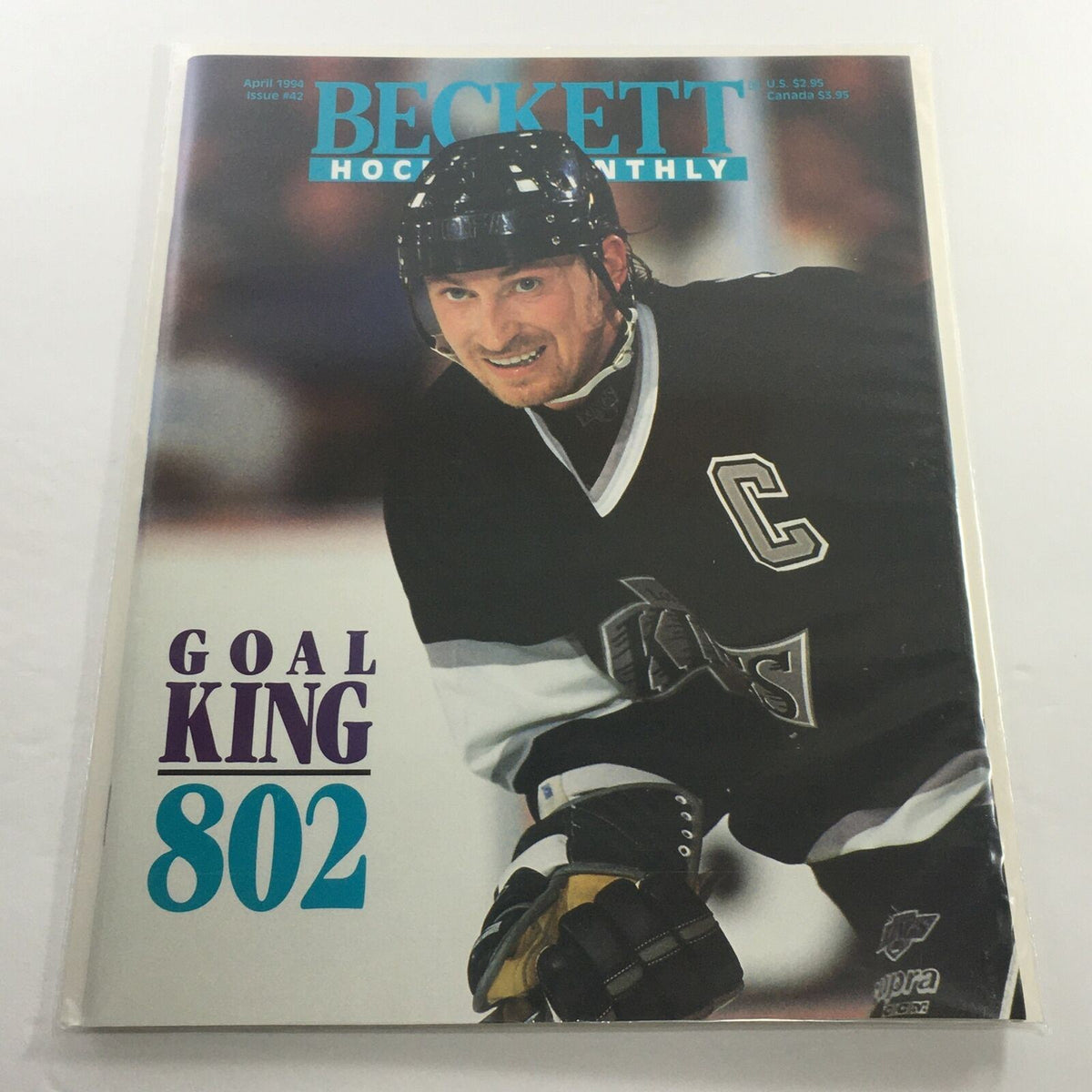 Beckett Hockey Monthly: April 1994 Issue #42 featuring Goal King 802, showcasing a hockey player in action with a determined expression, emphasizing the magazine's focus on hockey collectibles and sports news.