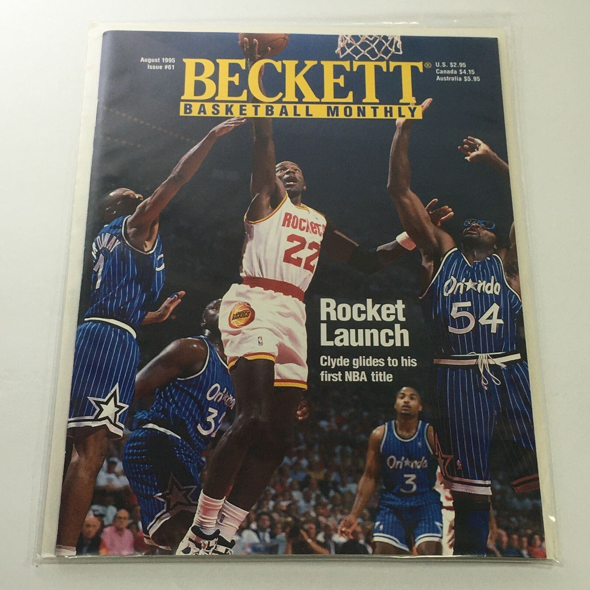 Beckett Basketball Monthly August 1995 Issue #61 featuring Rocket Launch NBA Title with Clyde Drexler gliding to his first NBA title, surrounded by players from the Orlando Magic.