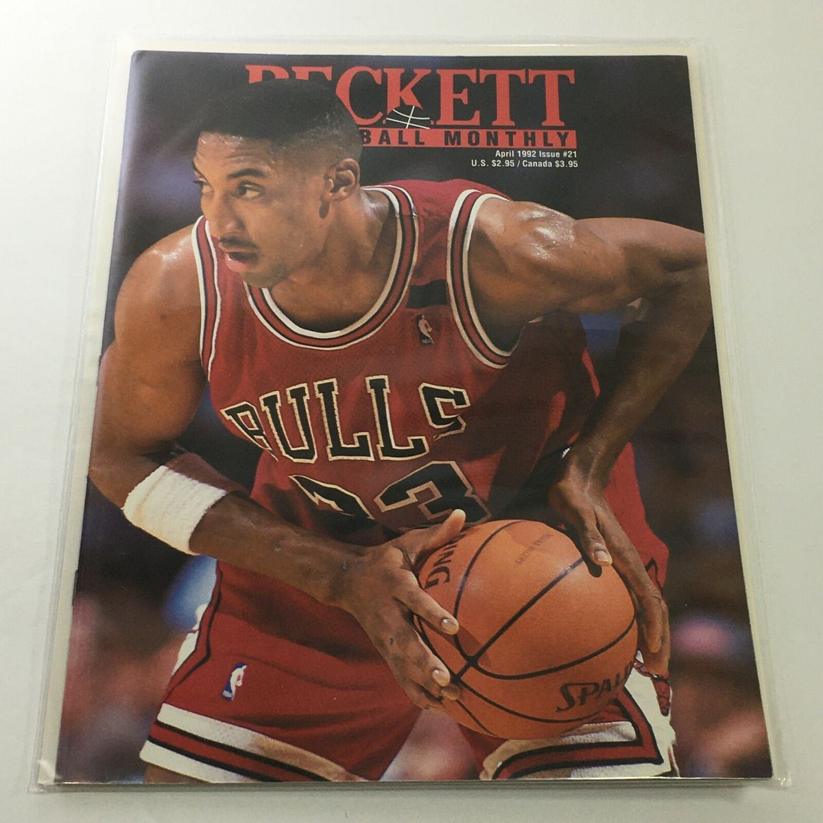 Beckett Basketball Monthly: April 1992 Issue #21 featuring Scottie Pippen in action, holding a basketball while wearing a red Chicago Bulls jersey.