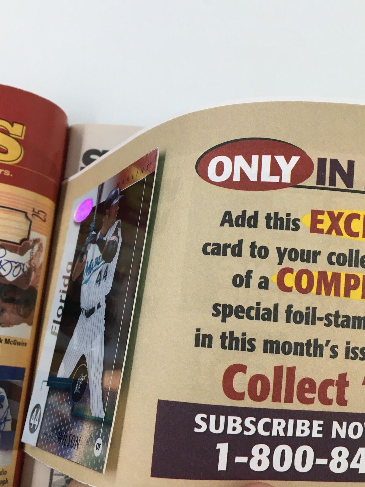 Beckett Baseball Card Monthly October 2002 advertising a Preston Wilson baseball card promotion, highlighting a special foil-stamped card exclusive to subscribers.