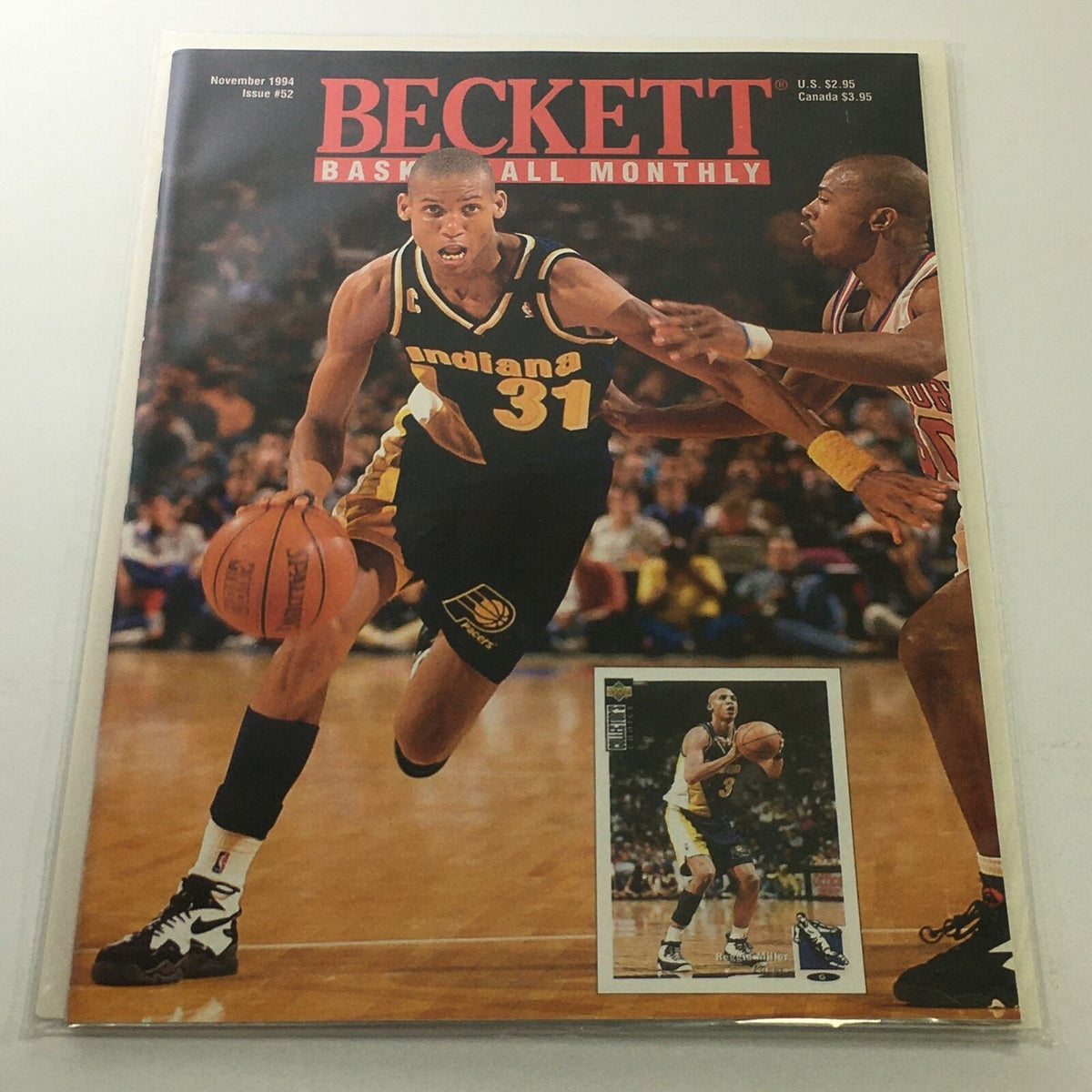 Beckett Basketball Monthly: November 1994 Issue #52 featuring Indiana Reggie Miller on the cover, showcasing Miller in action on the basketball court, highlighting his sports gear and iconic number 31 jersey.