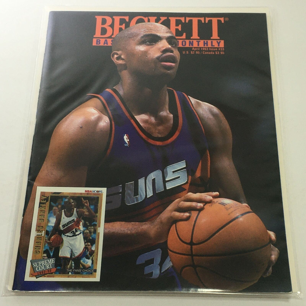 Cover of Beckett Basketball Monthly, April 1993 Issue #33 featuring Suns player Charles Barkley in action. The magazine emphasizes Barkley's role in basketball, showcasing a prominent image of him holding a basketball alongside a trading card.