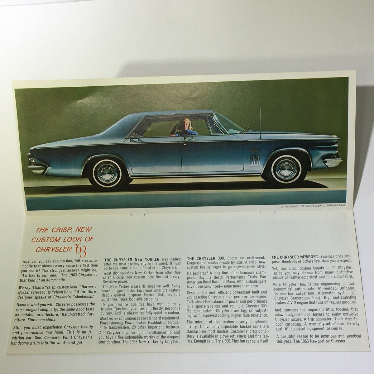 1963 New Yorker by Chrysler 300 catalog brochure inner page showcasing the sleek design of the Chrysler New Yorker and detailed text on its features.