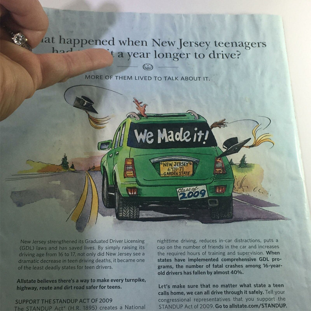 A playful cartoon illustration from The New Yorker June 22 2009 showcasing a car with the slogan 'We Made It!' emphasizing themes of youth and driving regulations in New Jersey.