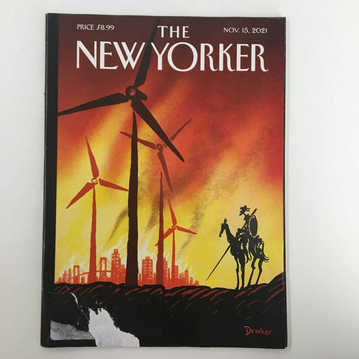 The New Yorker Full Magazine November 15, 2021 cover featuring artwork by Eric Drooker depicting wind turbines and a silhouette of a knight against a dramatic sunset.
