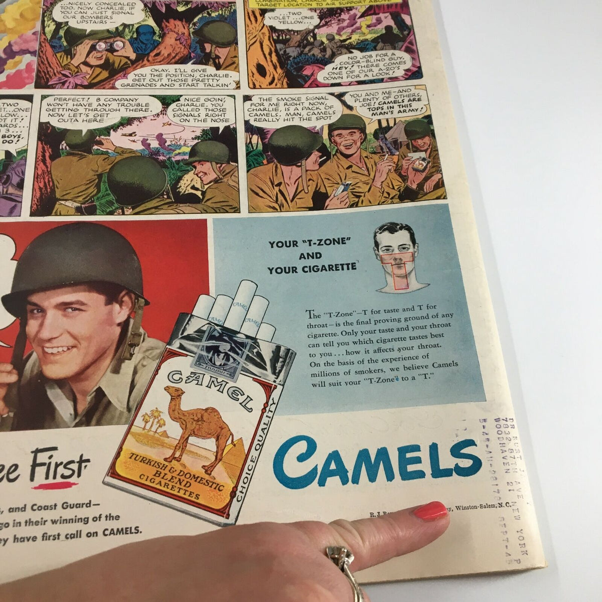 Interior page of VTG Life Magazine May 14, 1945, displaying a vintage advertisement for Camels Cigarettes alongside comic strip illustrations reflecting military themes.