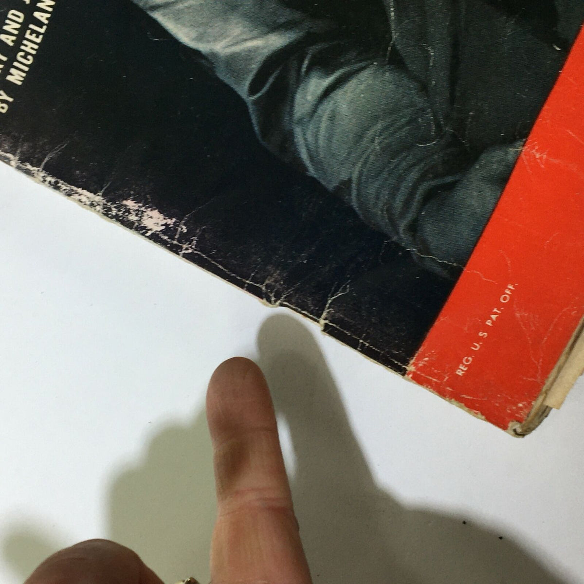 Close-up detail of the cover of Life Magazine December 16, 1957, showing wear and texture on the cover featuring Michelangelo's Mary and Jesus.