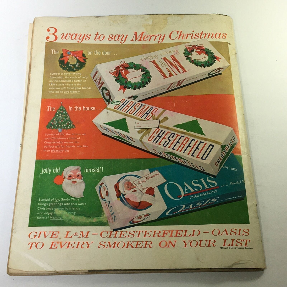 Vintage Life Magazine December 16 1957 cover featuring advertisements for L&M, Chesterfield, and Oasis cigarettes, showcasing festive holiday-themed packaging with a Christmas wreath, tree, and Santa Claus illustration.