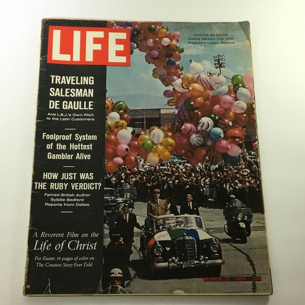 VTG Life Magazine March 27 1964 featuring Charles de Gaulle and President Lopez Mateos on the cover, showcasing a vibrant parade scene filled with balloons and crowds, highlighting historical events of the 1960s.