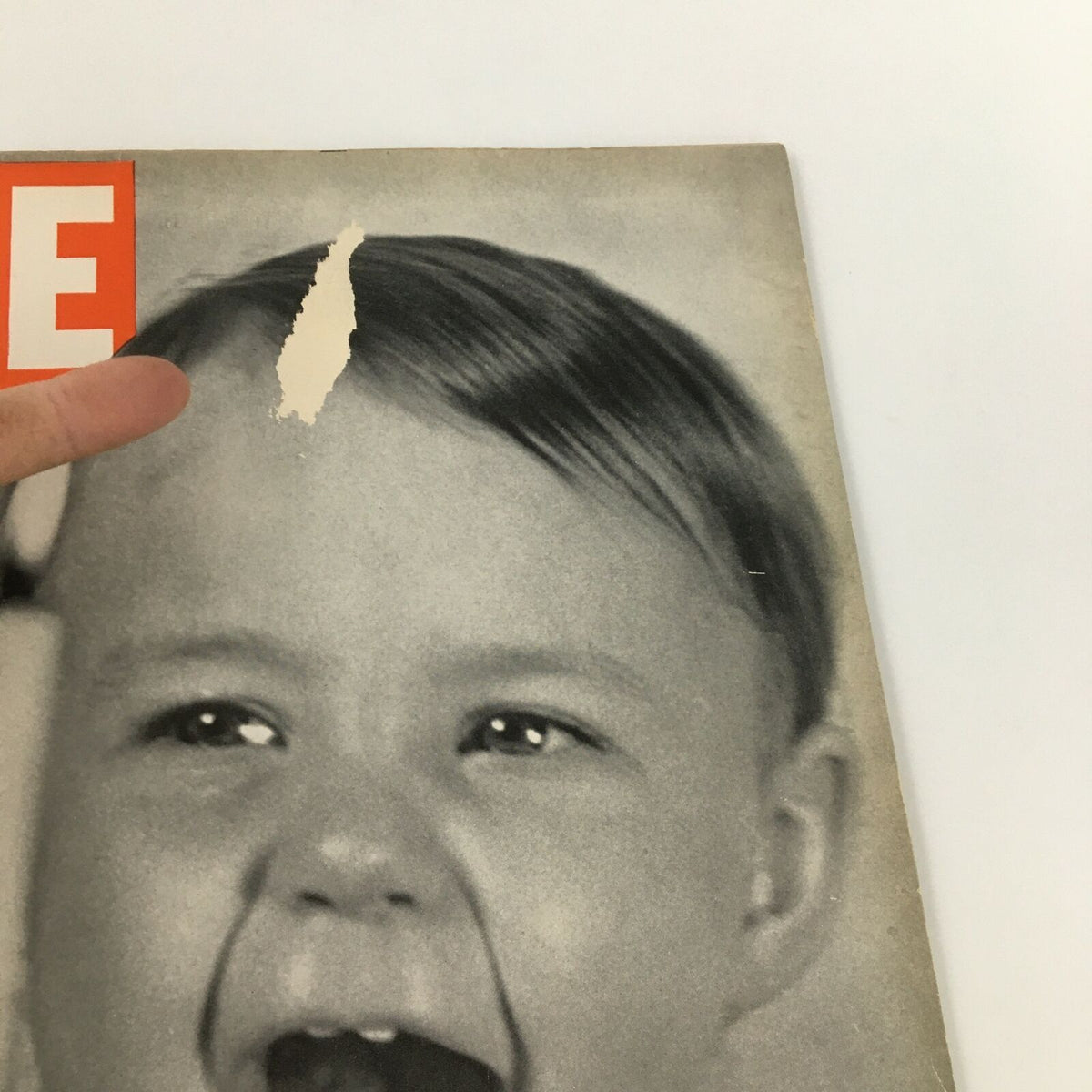 Close-up of the cover of VTG Life Magazine from November 28, 1938, showcasing a child's happy expression and minor wear details.