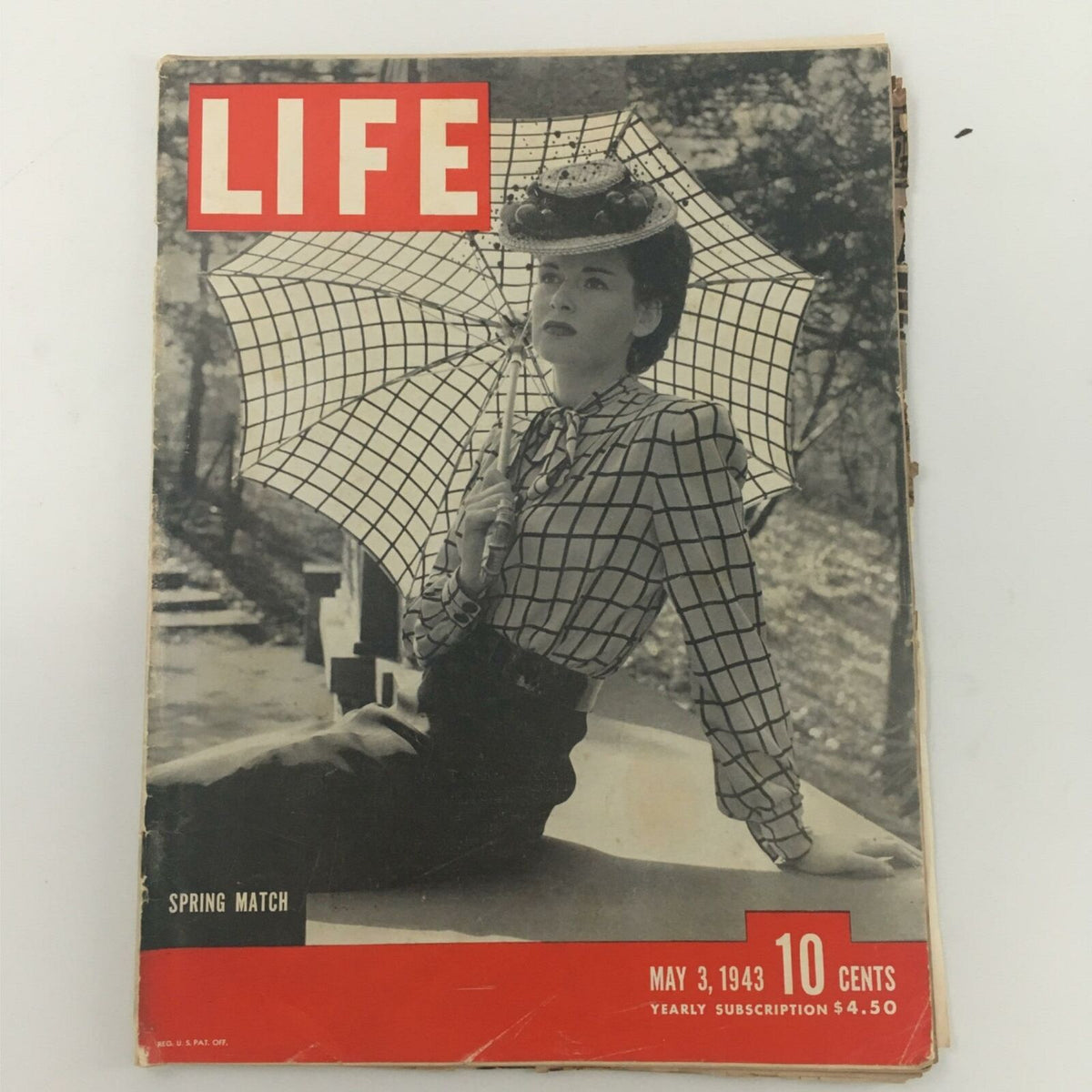 Cover of VTG Life Magazine May 3, 1943 featuring a woman with a hat and umbrella, highlighting the Spring Match issue.