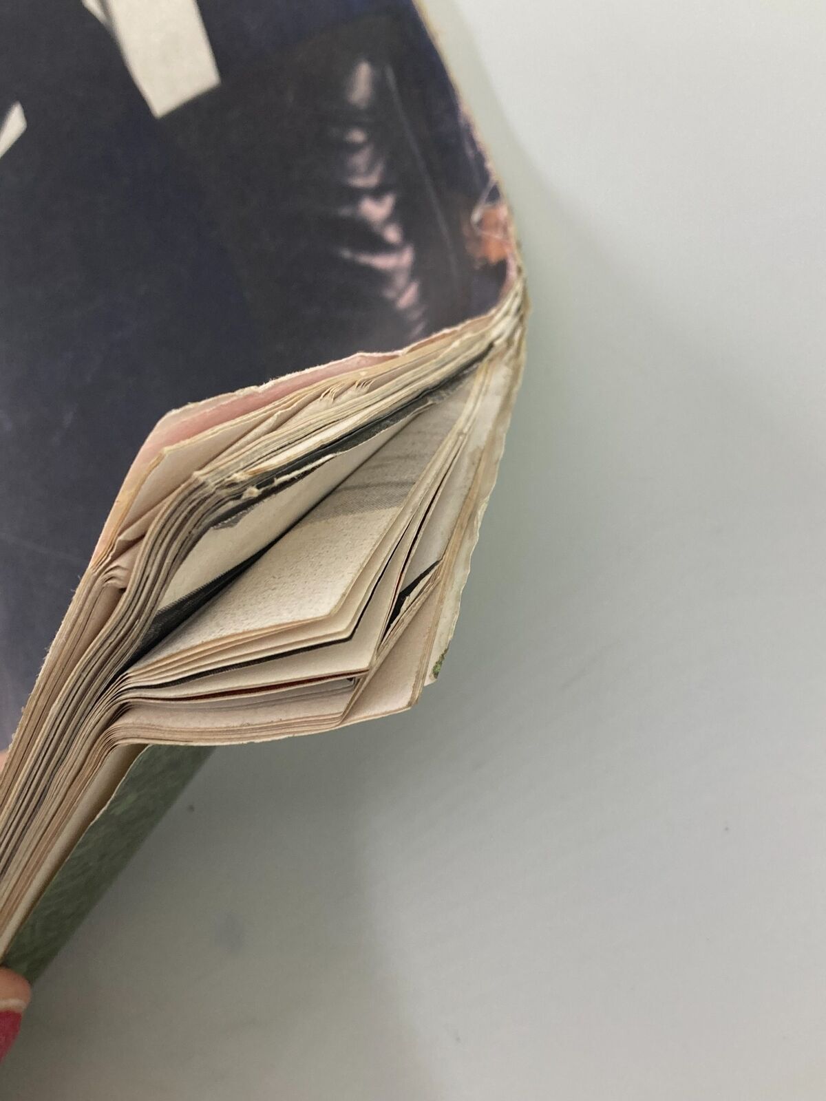 Close-up view of the spine and pages of VTG Life Magazine from December 13, 1963 featuring Lyndon B. Johnson at the White House, showcasing signs of wear typical for vintage issues.