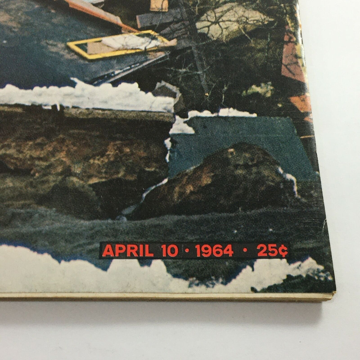 Close-up of the bottom section of VTG Life Magazine April 10 1964 highlighting the issue date and price, alongside visuals of the destruction from the Alaska earthquake.