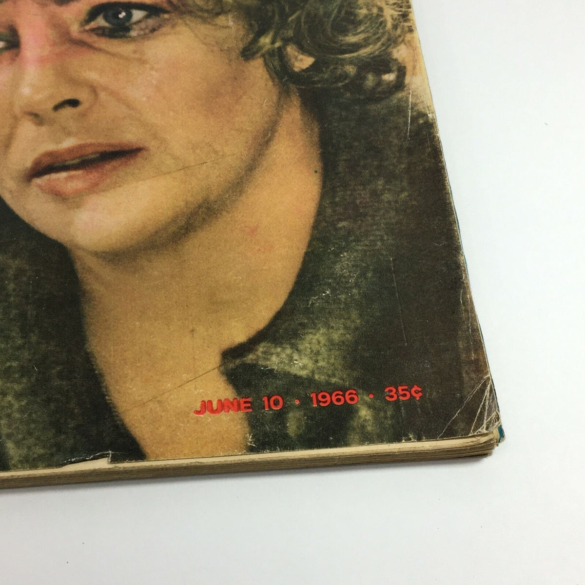 Close-up of the bottom corner of VTG Life Magazine from June 10, 1966, showcasing the publication date and price. Features Elizabeth Taylor on the cover with a focus on her facial details and expression.
