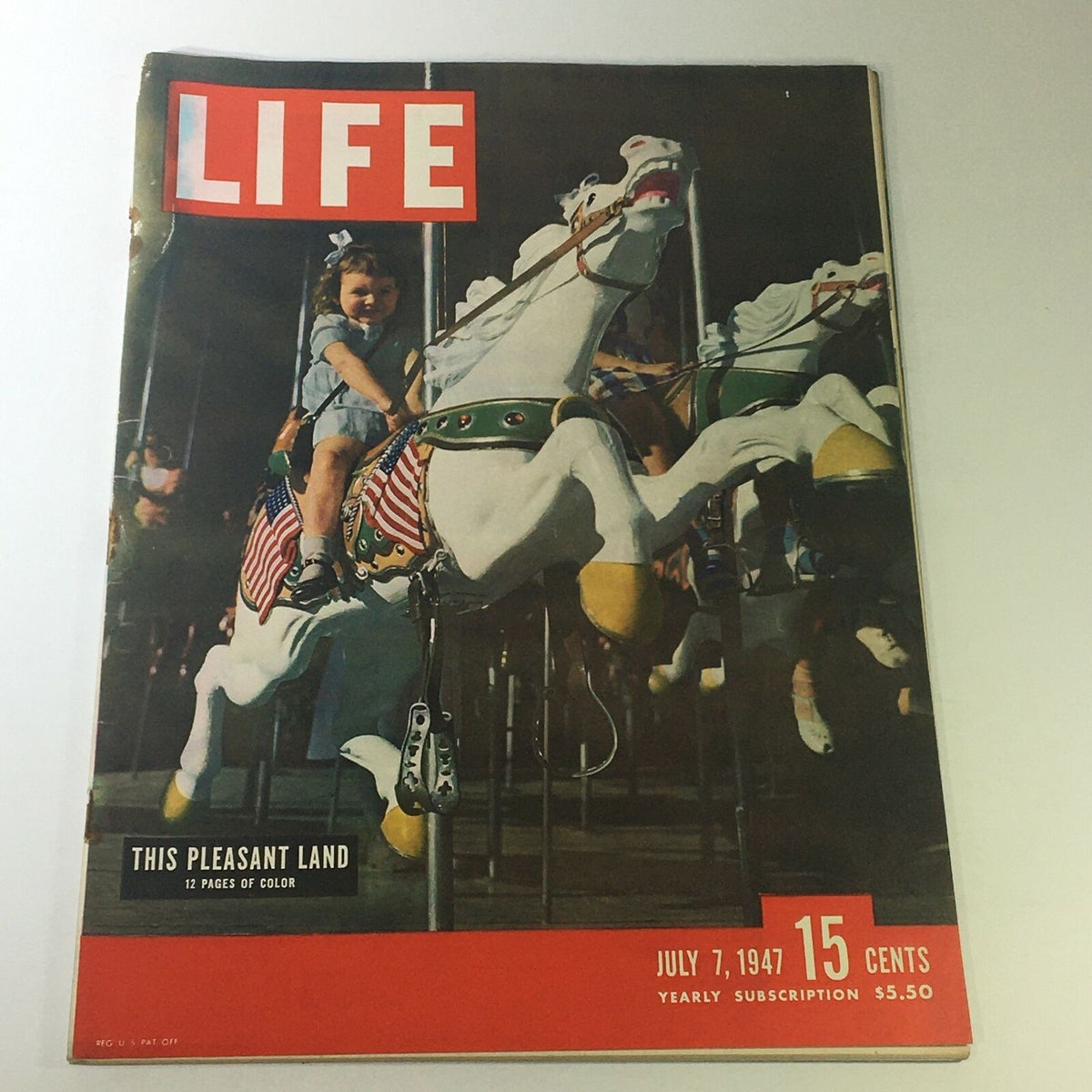 Cover of VTG Life Magazine July 7 1947 featuring a pleasant child on a carousel, showcasing vibrant colors and classic magazine design.