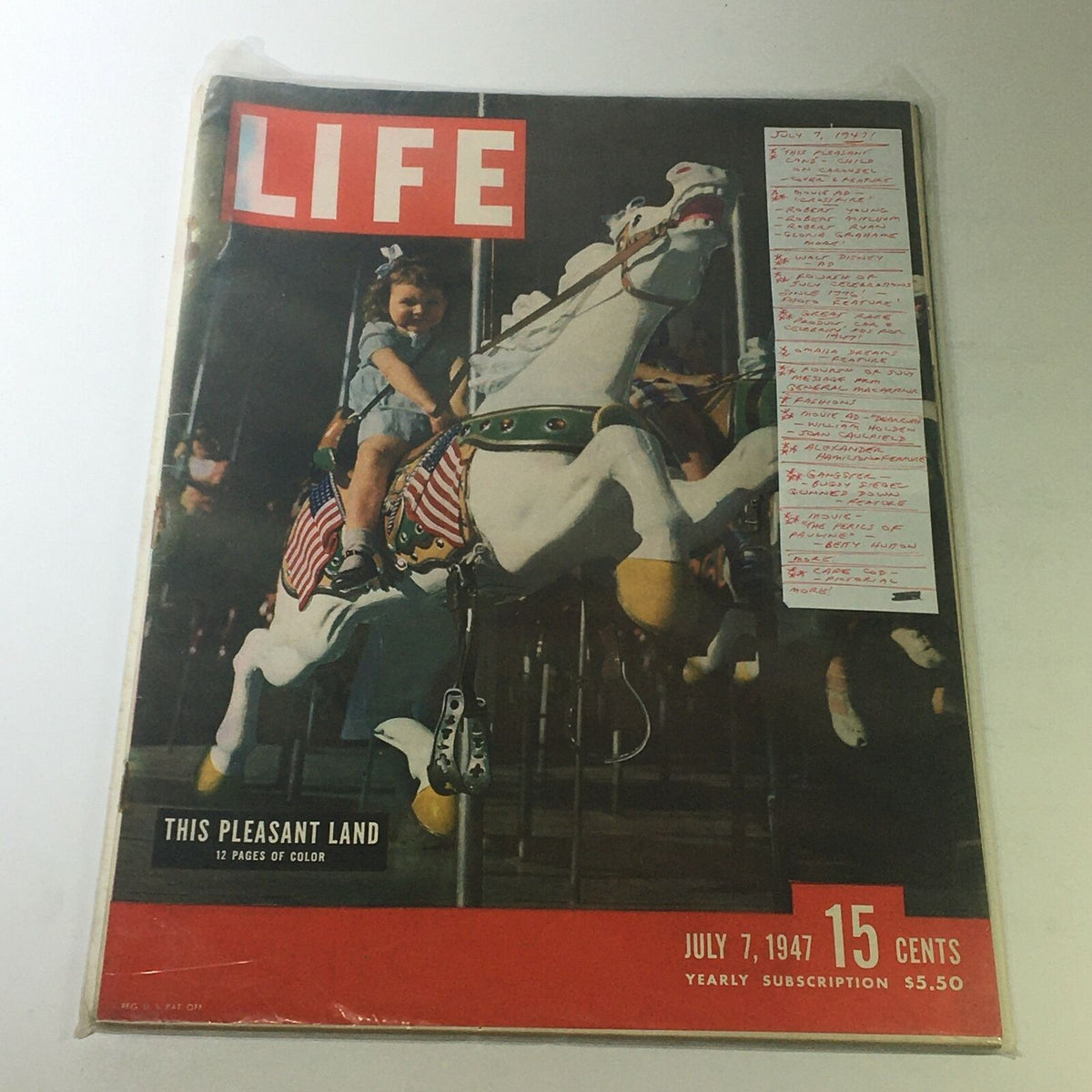 Vintage Life Magazine dated July 7, 1947, featuring a child on a carousel on the cover, showcasing nostalgic imagery from mid-20th century America.