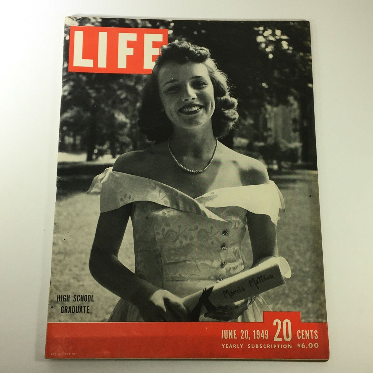 Vintage Life Magazine from June 20, 1949 featuring high school graduate Marcia Mattson on the cover, showcasing her in a white dress holding a diploma, representing post-war American youth.