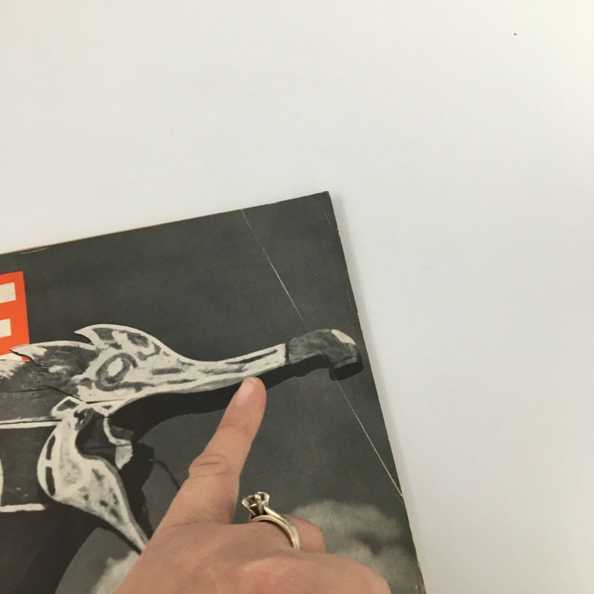 Close-up view of the VTG Life Magazine August 16 1937 cover, highlighting the detailed design of the dragon-shaped structure with a finger pointing at a distinctive feature.