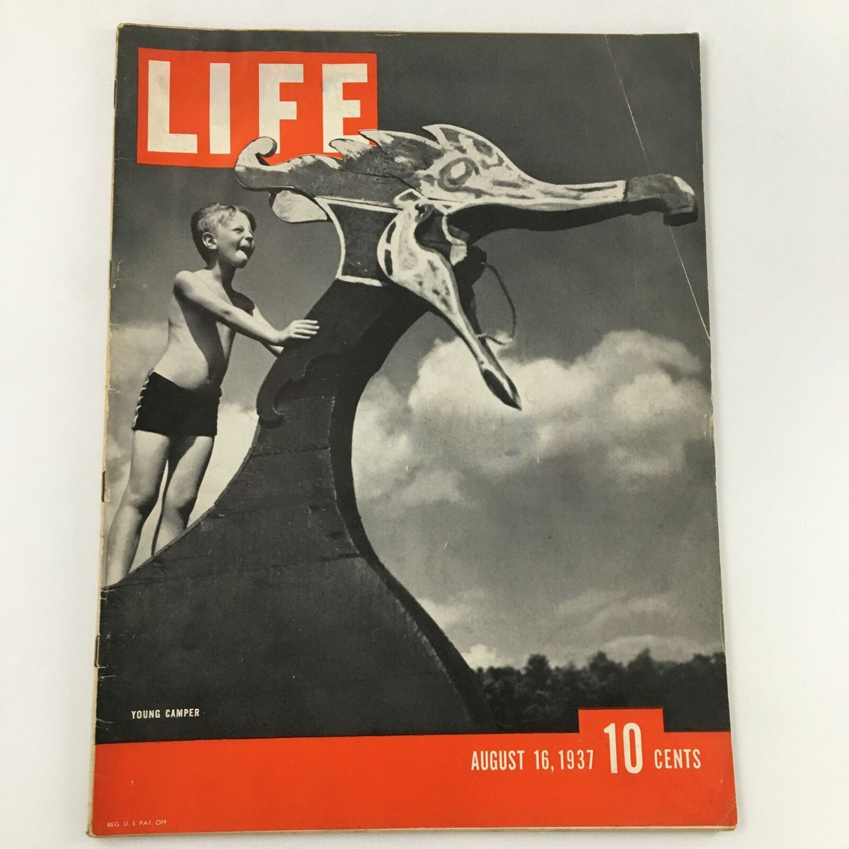 VTG Life Magazine August 16, 1937 featuring a captivating cover photo of a young camper beside a whimsical dragon-shaped structure.