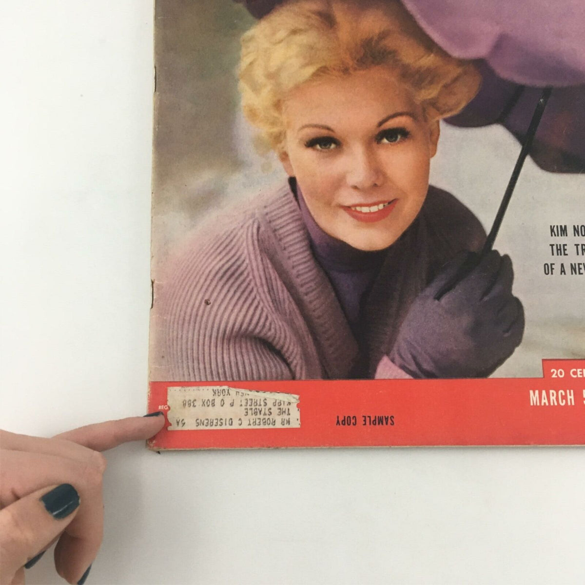 Close-up of the vintage Life Magazine from March 5, 1956, featuring Kim Novak's cover, highlighting the magazine's sample copy label and vintage charm.