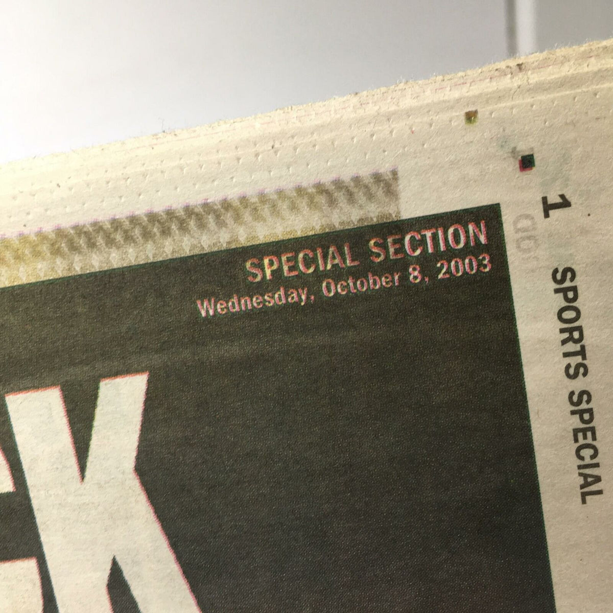 Detail of the Sports Special Daily News date, indicating 'Wednesday, October 8, 2003'.