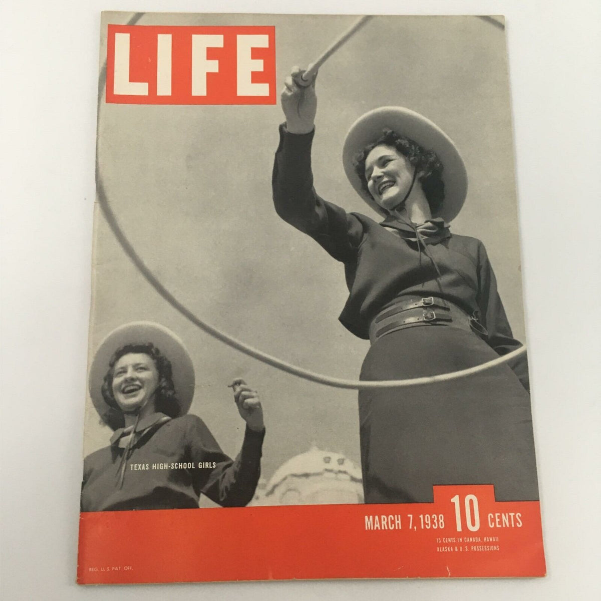 Cover of VTG Life Magazine dated May 7, 1938, featuring Texas High-School Lasso Girls, highlighting their lasso skills in a vintage photography style.
