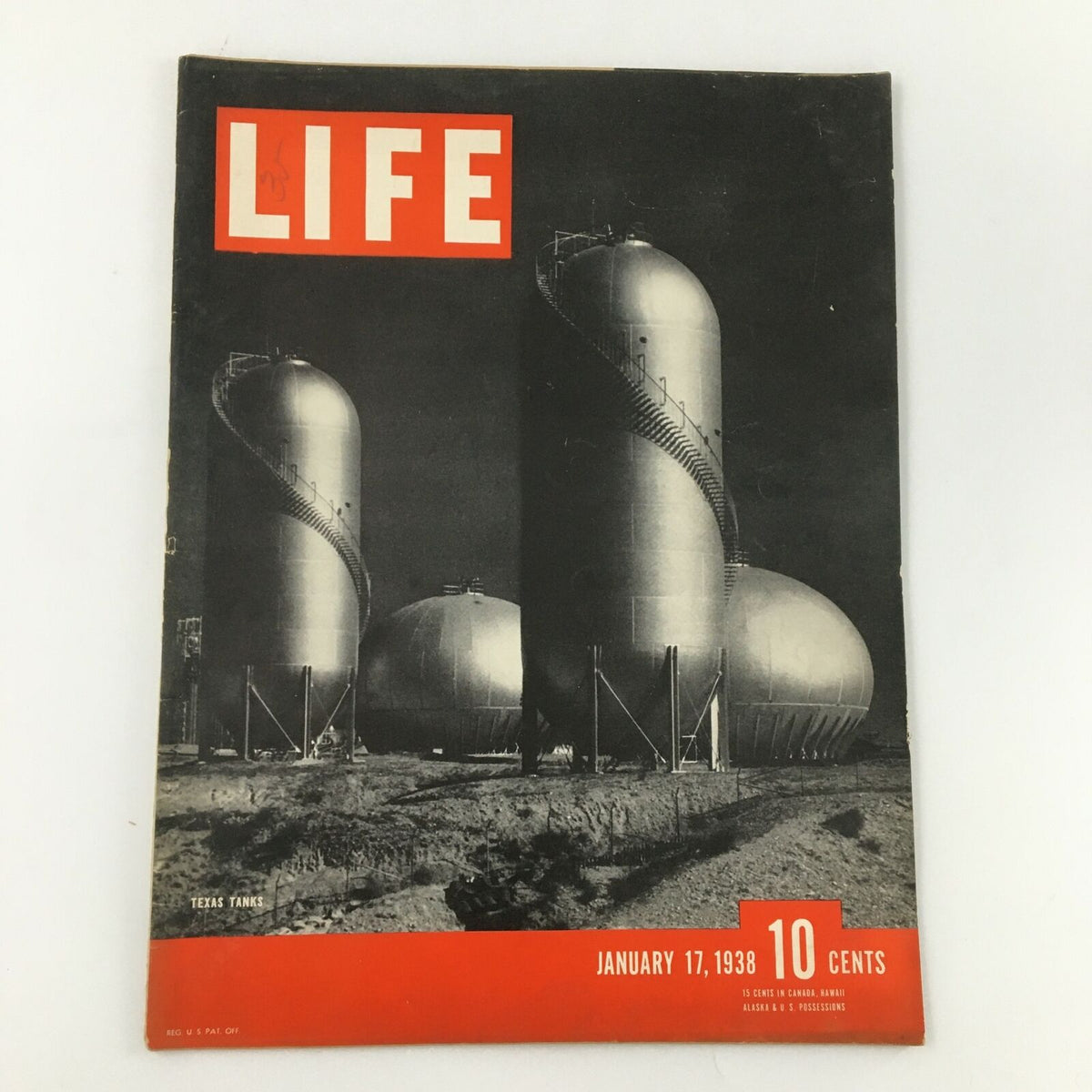 Vintage Life Magazine cover from January 17, 1938, featuring Texas oil tanks, showcasing a pivotal era in history and luxury travel narratives like the Queen Mary.