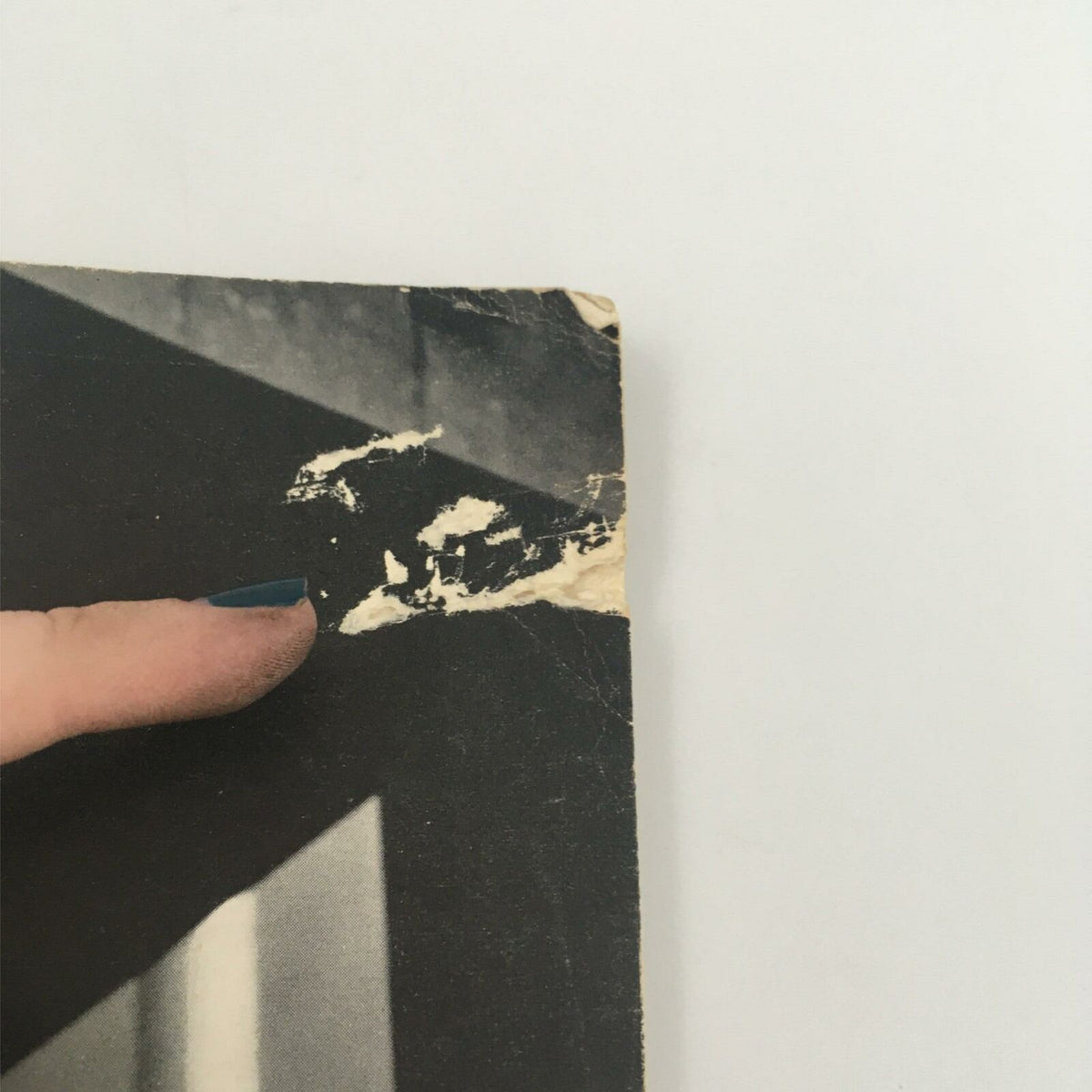 Close-up view of the damaged corner of the VTG Life Magazine January 18, 1937, highlighting signs of wear and age.
