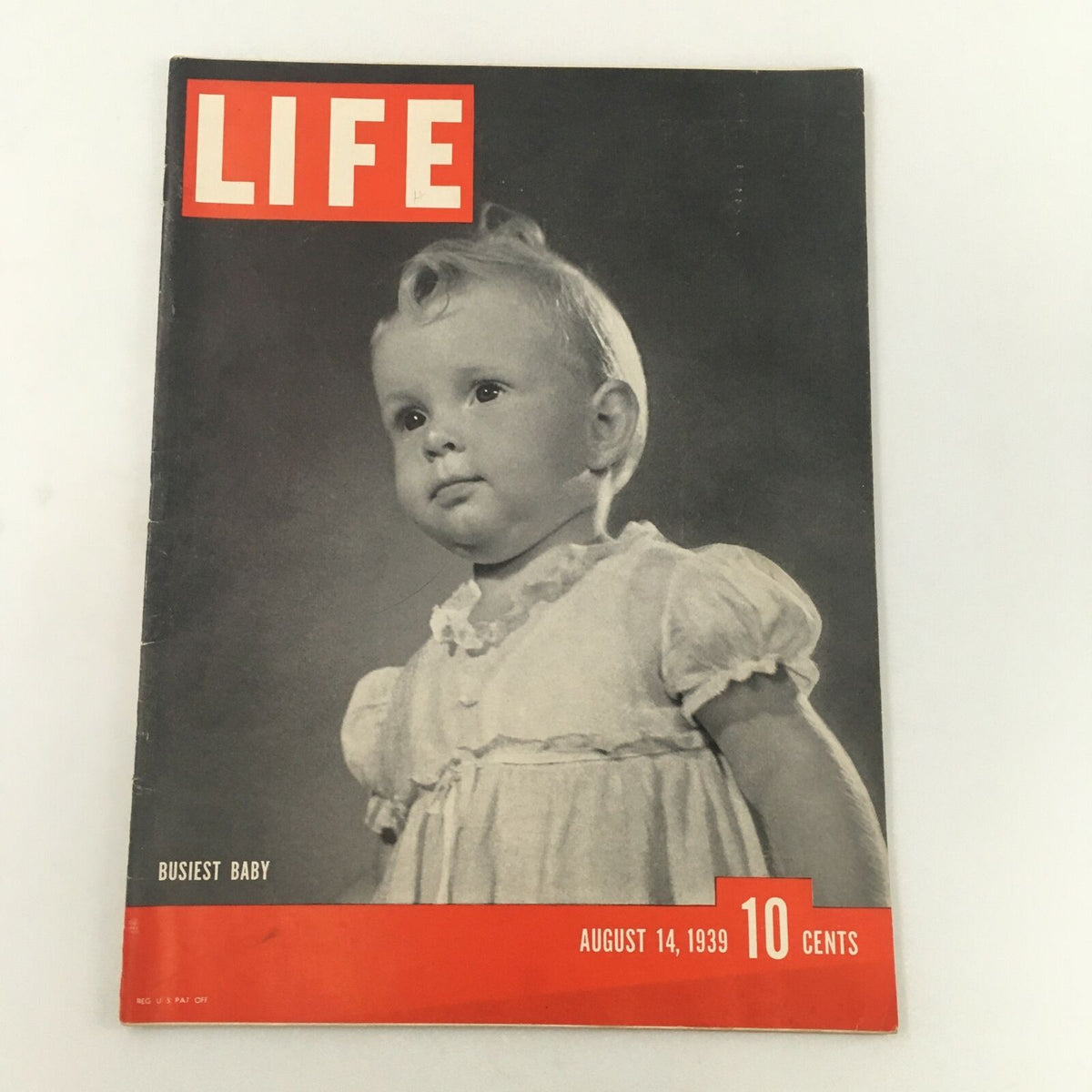Vintage Life Magazine from August 14, 1939 featuring a cover photograph titled 'Busiest Baby', showcasing a charming image of a baby in a light-colored dress, indicative of pre-war American childhood nostalgia.