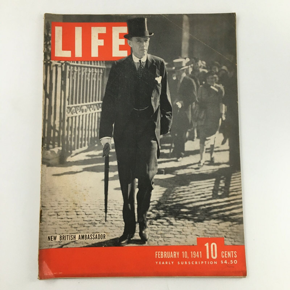 Cover of VTG Life Magazine February 10 1941 featuring the new British Ambassador. The image depicts a formal man in a top hat walking with an umbrella amidst a historical urban setting, illustrating typical fashion of the early 1940s.