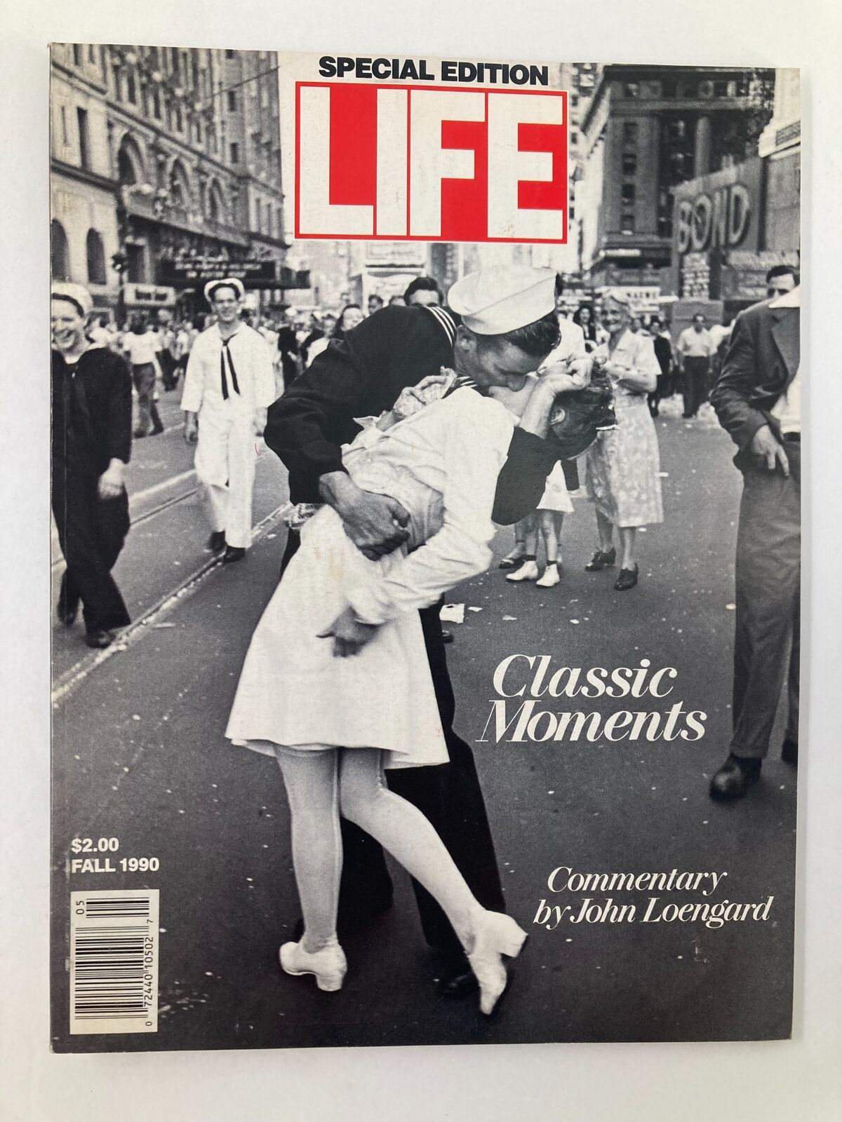 Cover of Life Magazine Fall 1990 featuring classic moments, with a notable kiss between a sailor and a woman in Times Square, emphasizing romance and historical context. Commentary by John Loengard.
