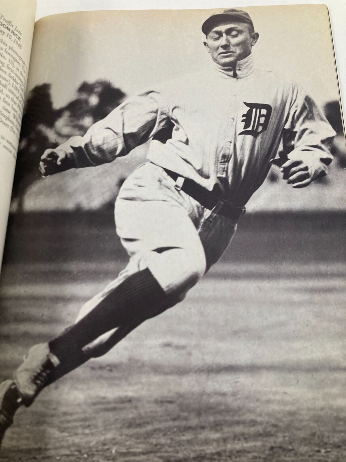 Historic Life Magazine Fall 1990 Classic Moments by John Loengard featuring a baseball player in motion, dressed in a white uniform with a 'D' logo, showcasing athleticism and vintage sports photography.