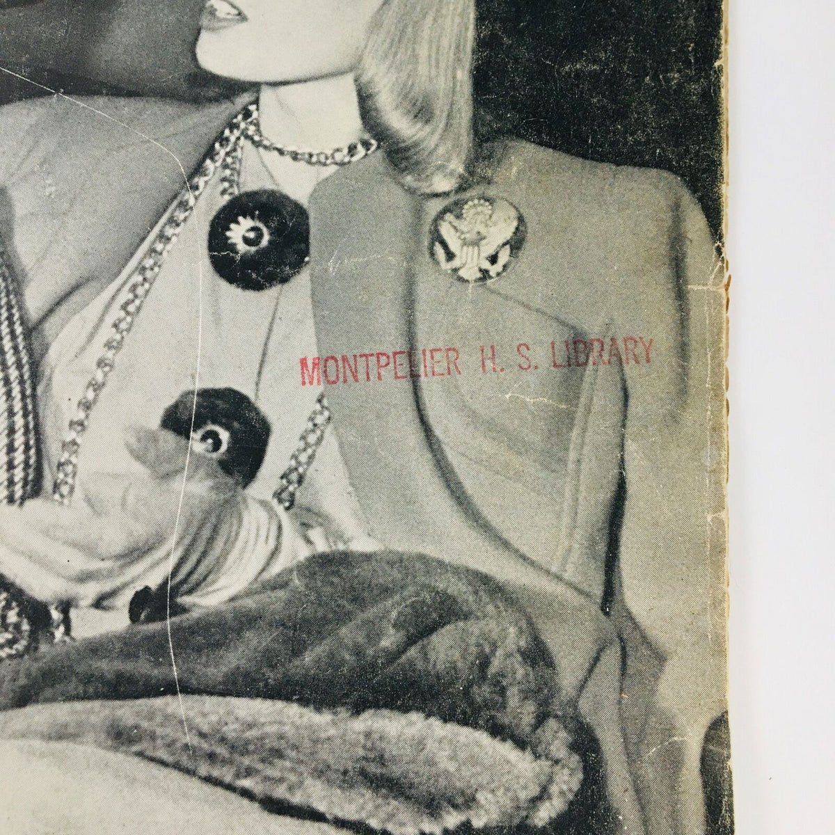 Image from the VTG Life Magazine December 23 1940 cover featuring the young woman dressed in vintage fashion with library stamp, adding historical context.