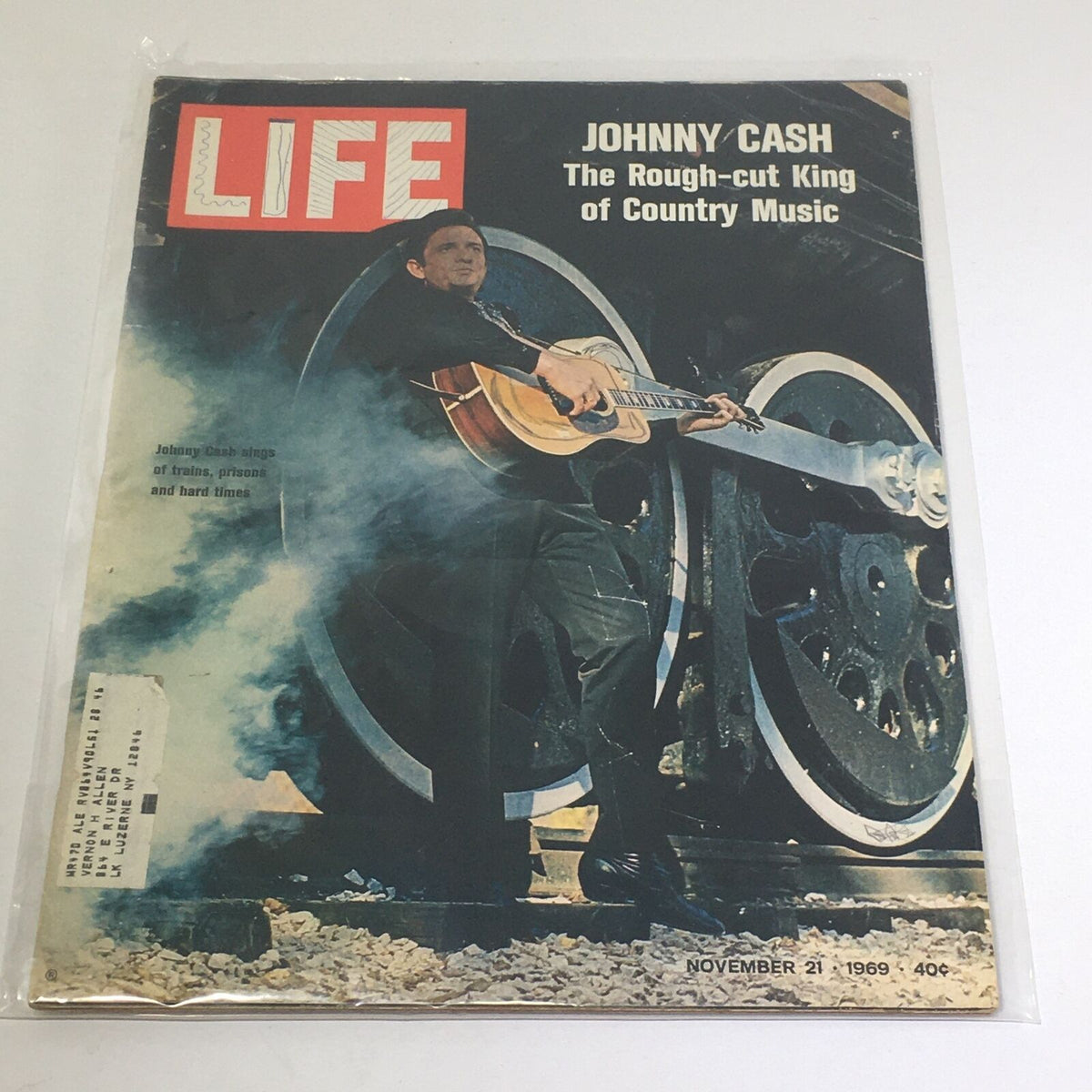 Vintage Life Magazine cover from November 21, 1969, featuring Johnny Cash, the Rough-cut King of Country Music, with a dynamic image of him playing guitar by a train.